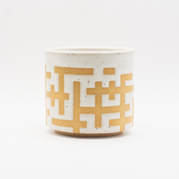 Handmade ceramic white tumbler with interlocking pattern