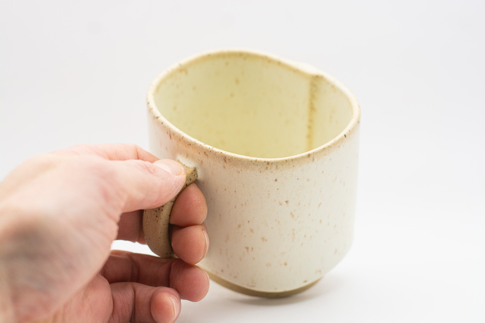 Handmade ceramic mug with rounded rectangular form