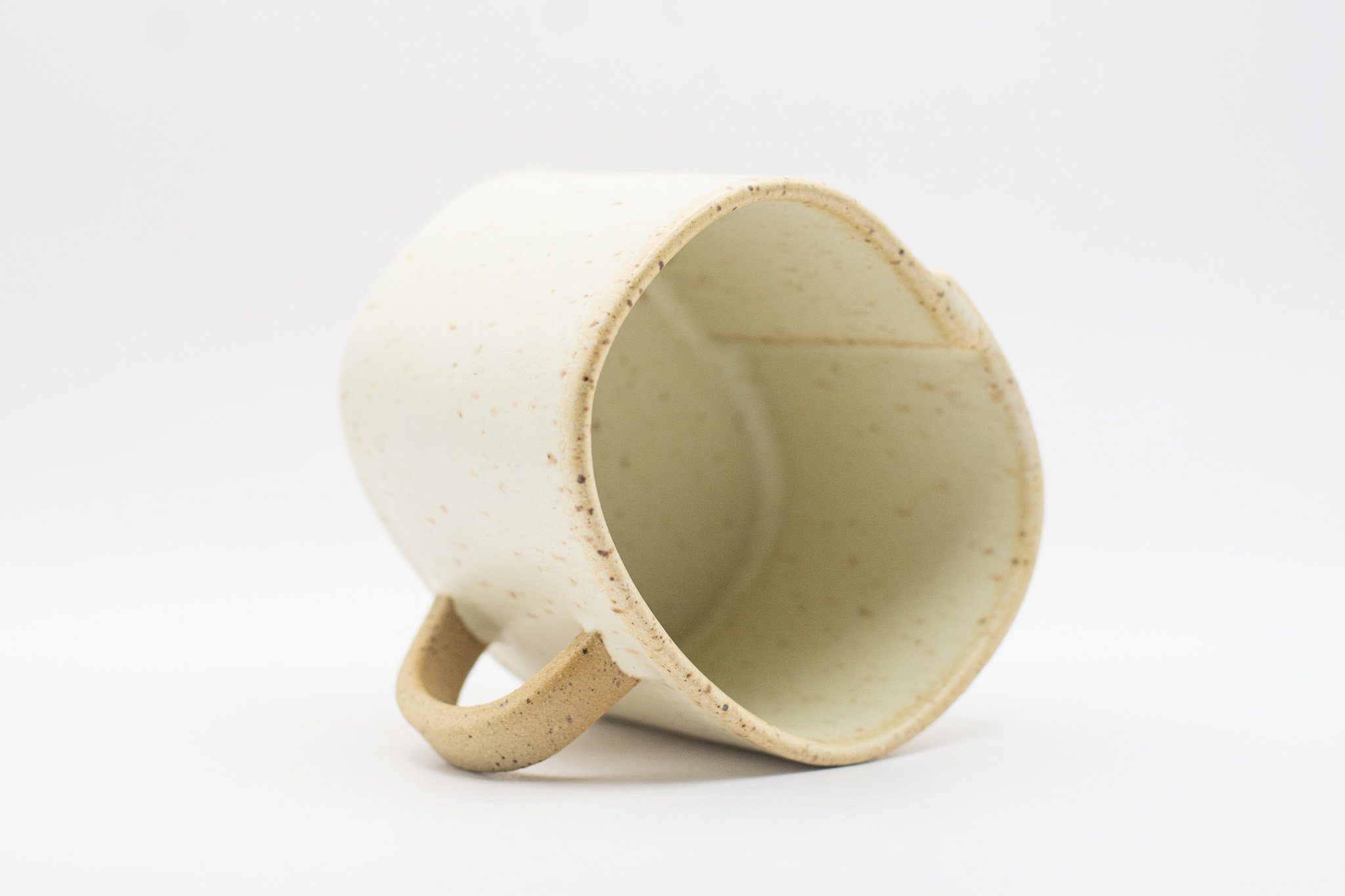 Handmade ceramic mug with rounded rectangular form