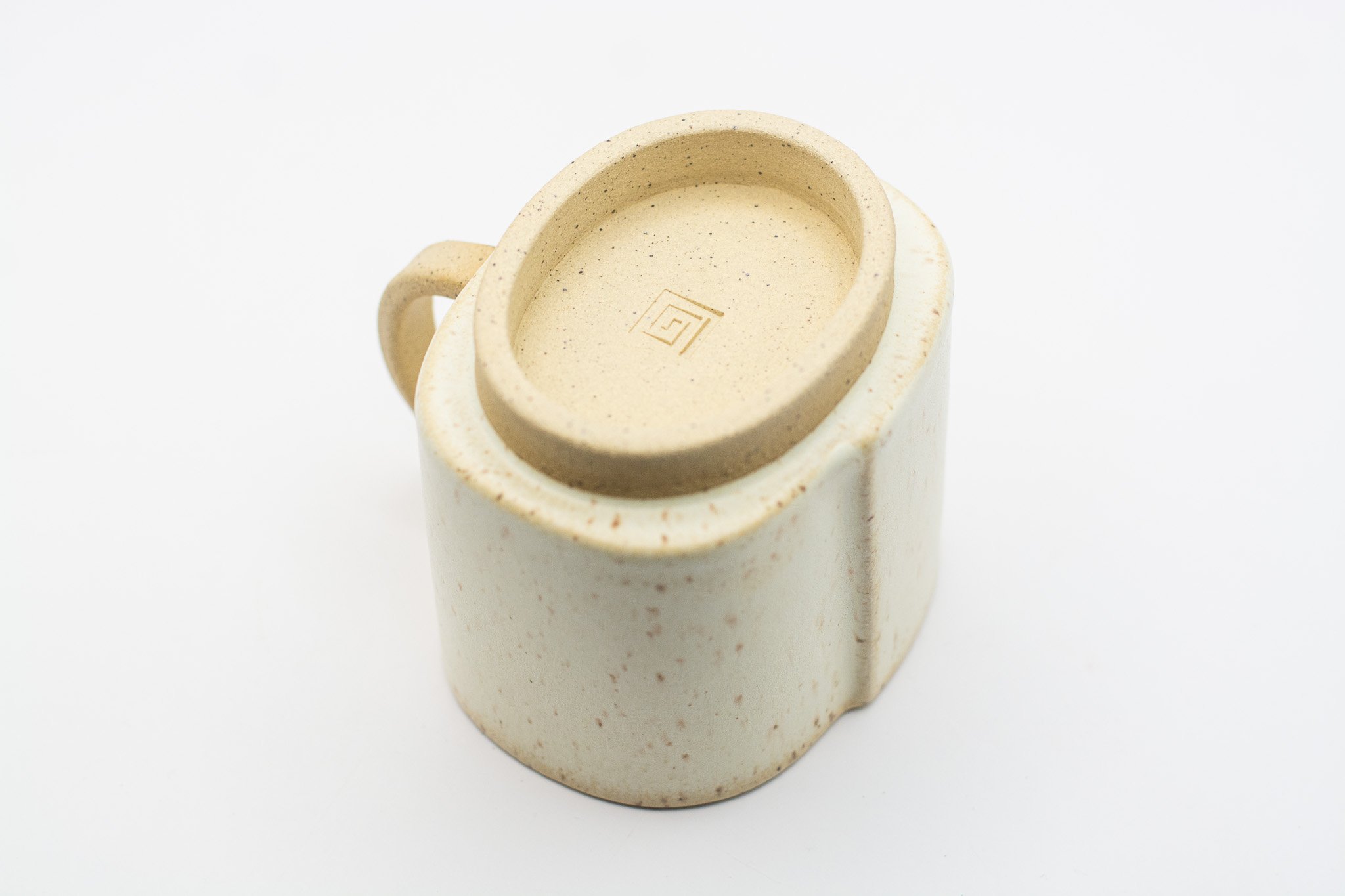 Handmade ceramic mug with rounded rectangular form