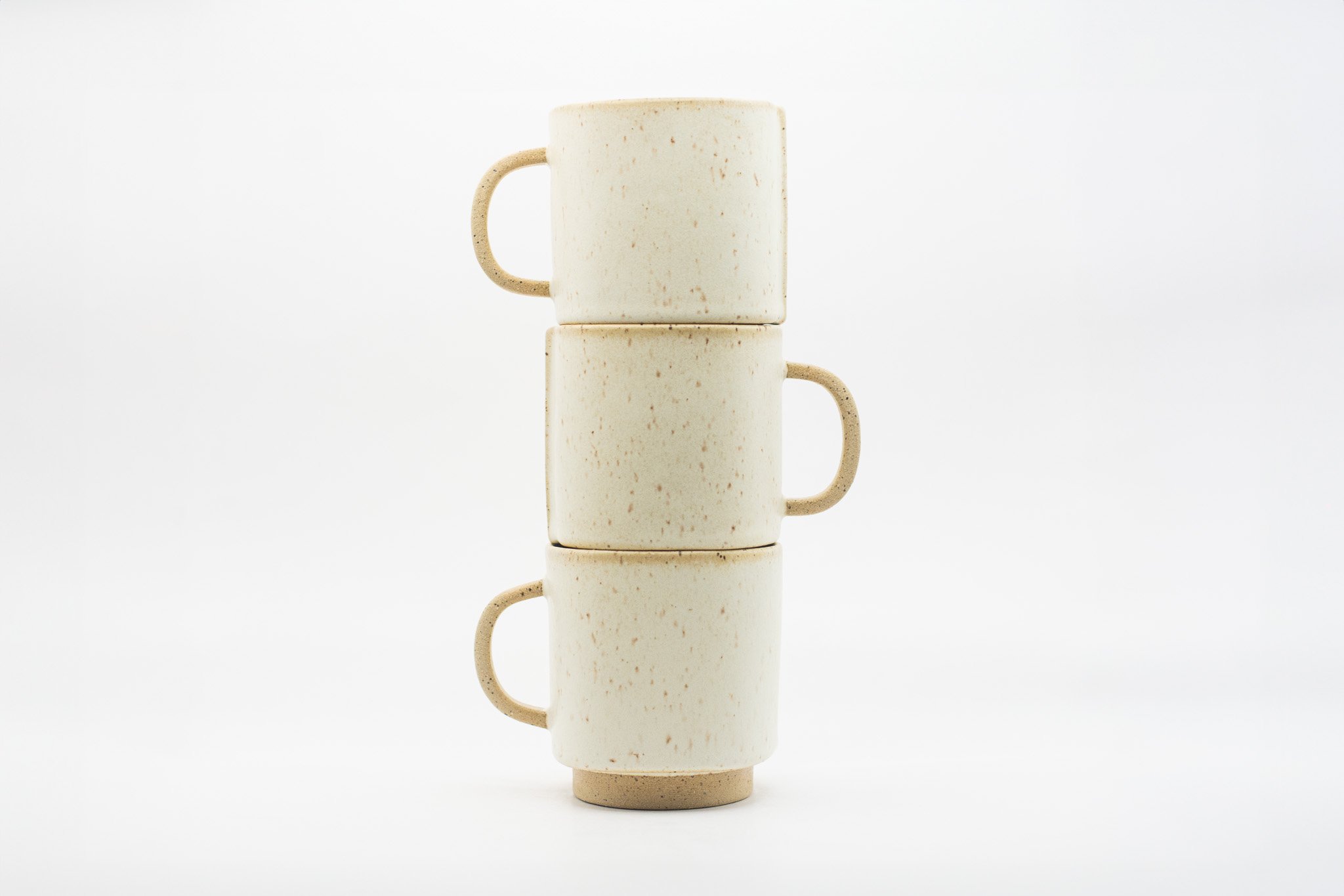 Stacked White Ceramic Mugs